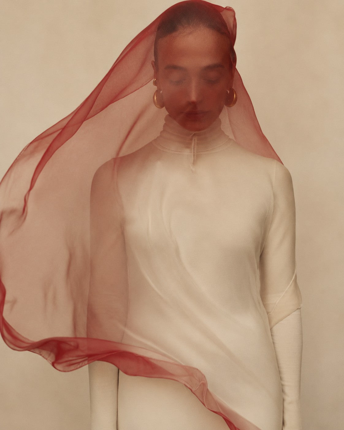 Zenya sheer red veil styled over cream layers
